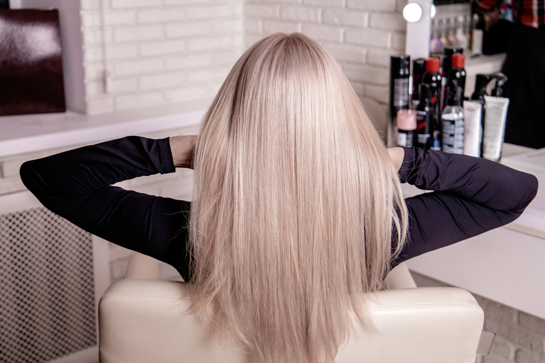 Female back with long, straight, blonde hair